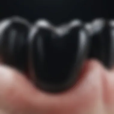 Close-up view of black deposits on dental enamel